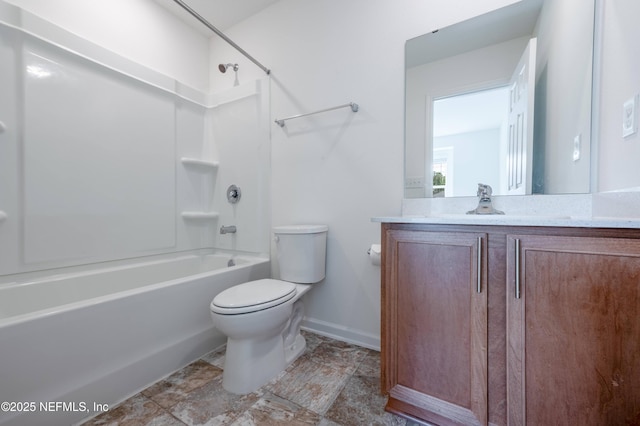 full bathroom featuring vanity, bathtub / shower combination, and toilet