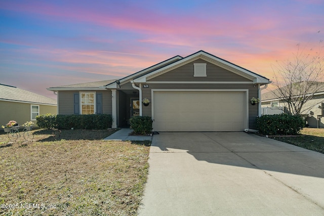 ranch-style home featuring a garage