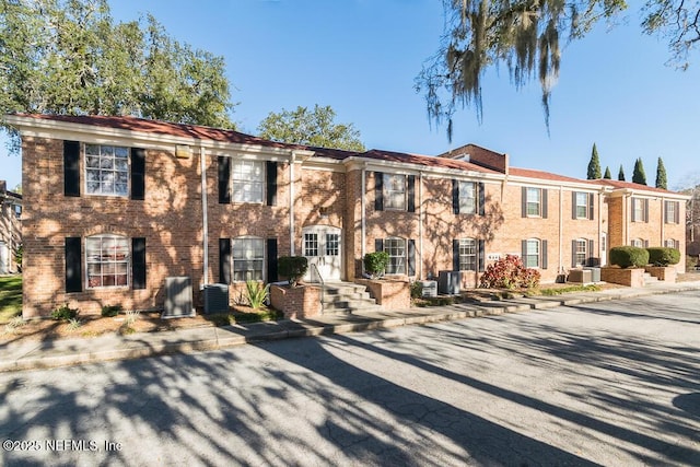 view of property featuring central AC unit