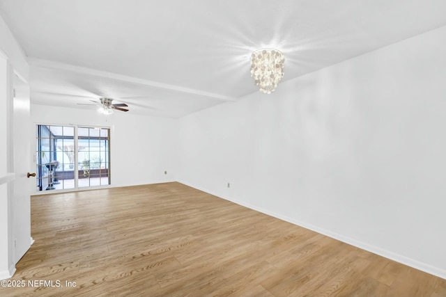 unfurnished room with light hardwood / wood-style floors and ceiling fan with notable chandelier