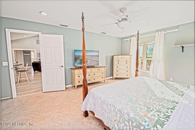 tiled bedroom featuring ceiling fan