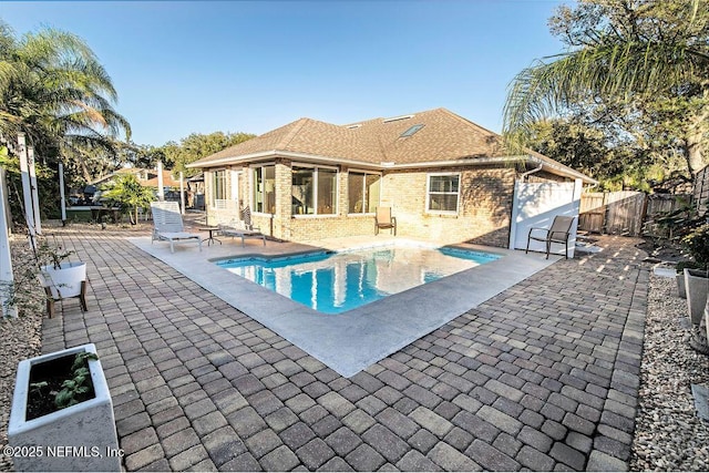 view of swimming pool featuring a patio