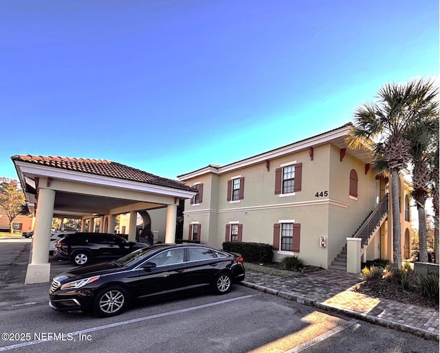 mediterranean / spanish home with a carport