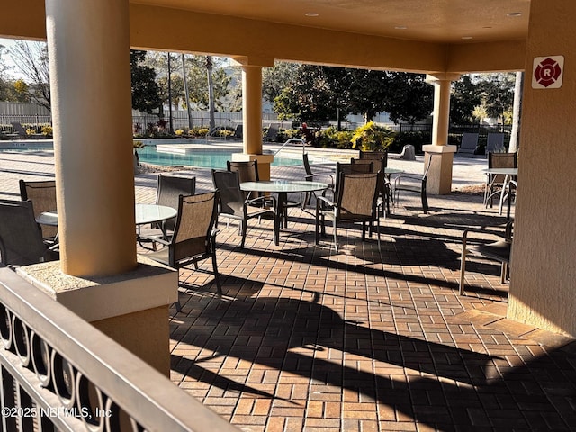 view of patio featuring a community pool