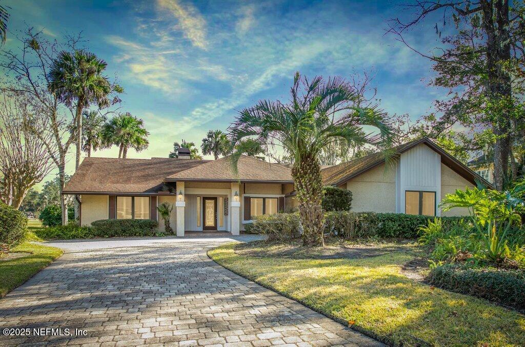 ranch-style house with a front yard