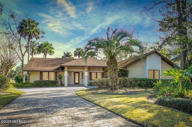 ranch-style house with a front yard