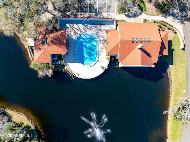 birds eye view of property with a water view