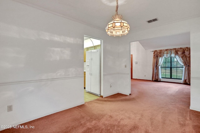 empty room with light colored carpet