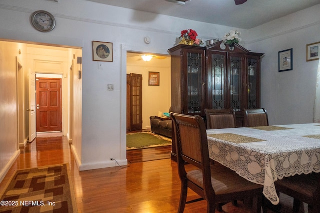 dining area with wood-type flooring