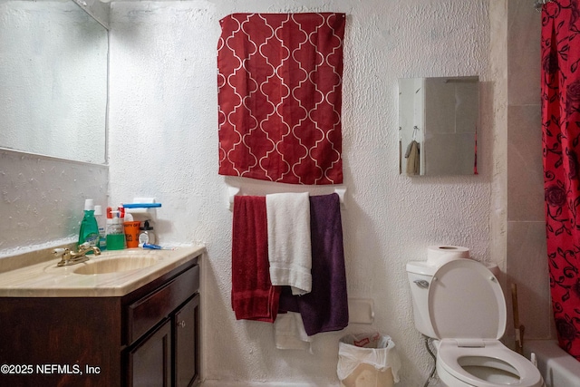 bathroom with toilet and vanity