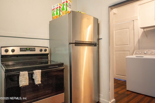 kitchen with stainless steel appliances, dark hardwood / wood-style flooring, and washer / clothes dryer