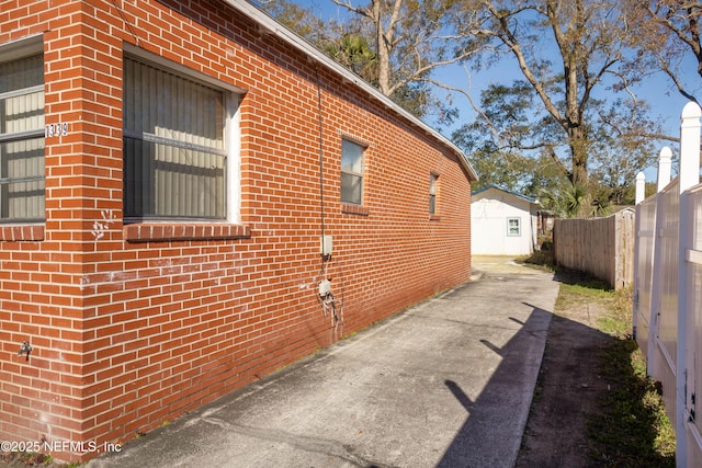 view of side of property featuring a patio area