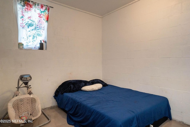 bedroom with brick wall and ornamental molding