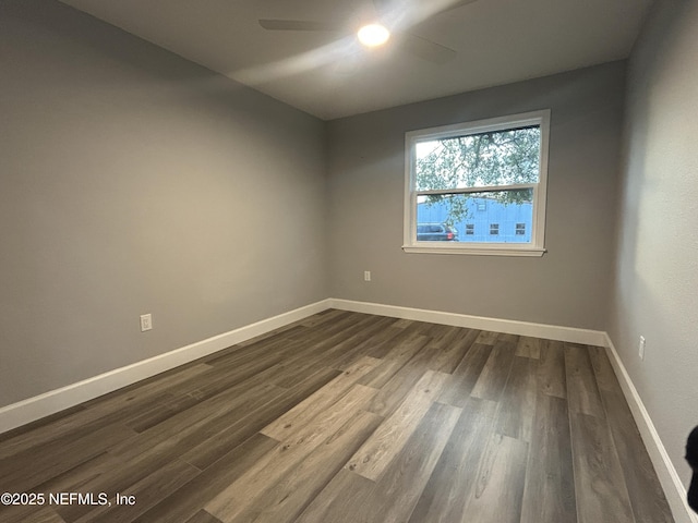 empty room with dark hardwood / wood-style floors