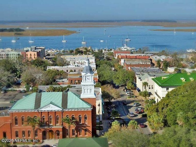 birds eye view of property featuring a water view