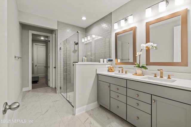 bathroom featuring an enclosed shower and vanity