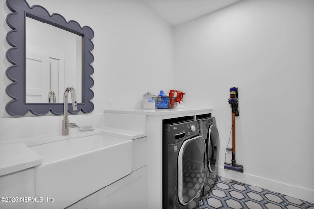 laundry area with washer and dryer and sink