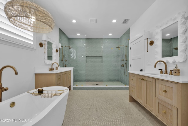 bathroom featuring plus walk in shower, tile patterned floors, and vanity