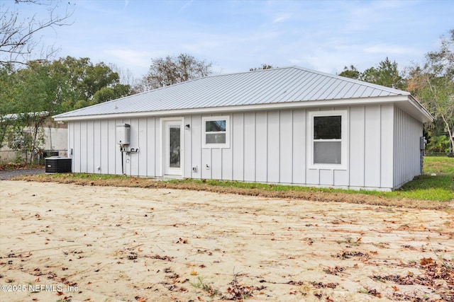 rear view of house with central AC