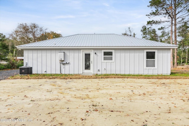 rear view of property with cooling unit