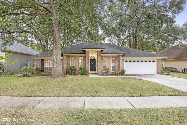 ranch-style house featuring a garage and a front lawn