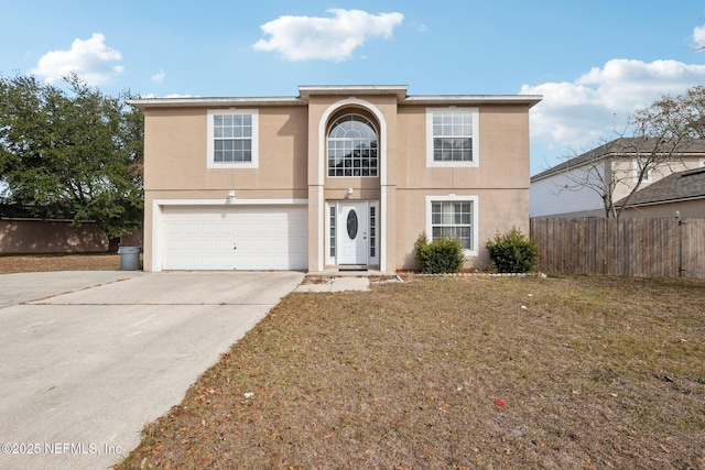 front of property featuring a front yard and a garage