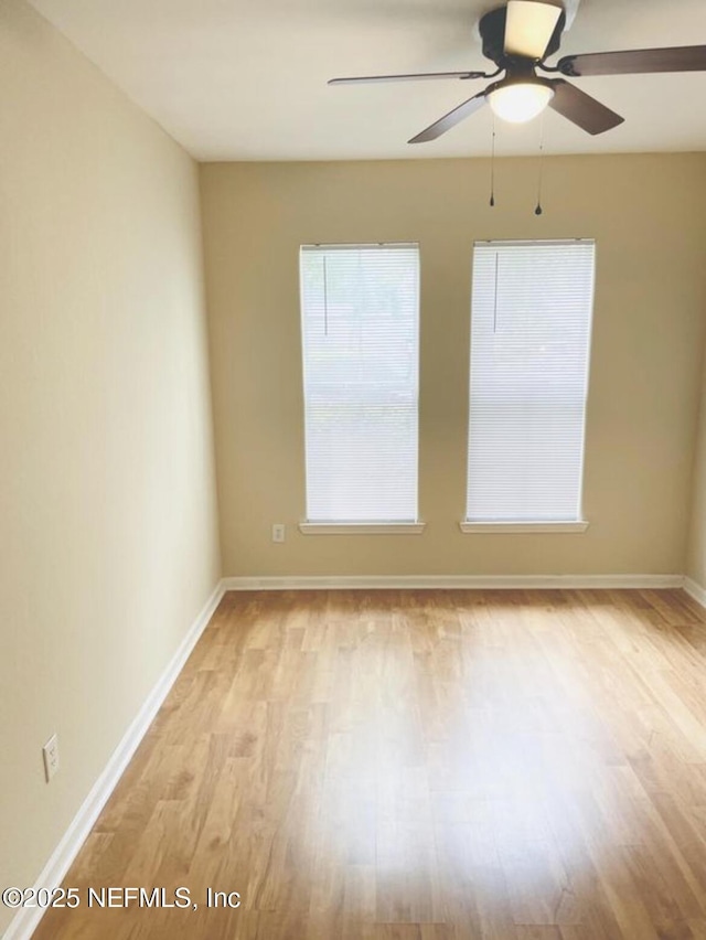 unfurnished room featuring ceiling fan and light hardwood / wood-style flooring