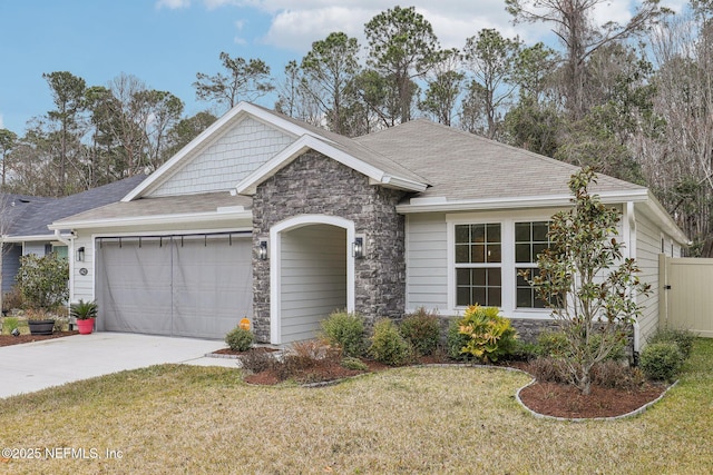 view of front of home with a garage and a front yard