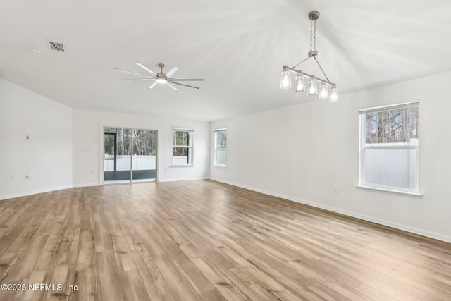 unfurnished living room featuring ceiling fan and light hardwood / wood-style flooring