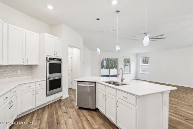 kitchen featuring white cabinetry, stainless steel appliances, and sink