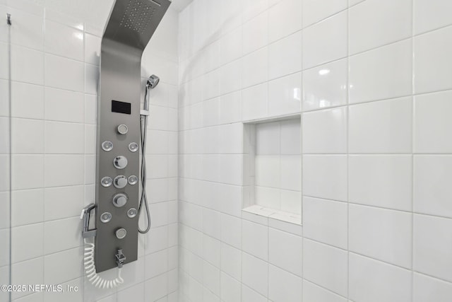 bathroom with a tile shower