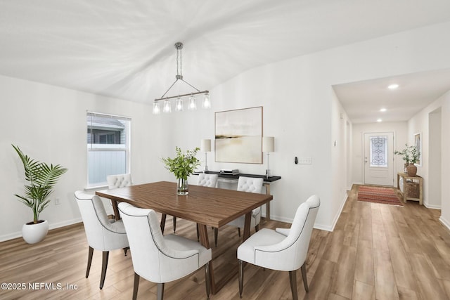 dining space featuring a wealth of natural light and light hardwood / wood-style flooring