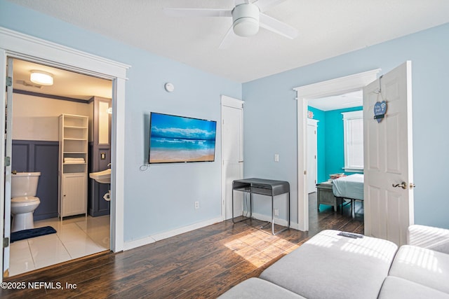 living room with ceiling fan and hardwood / wood-style floors