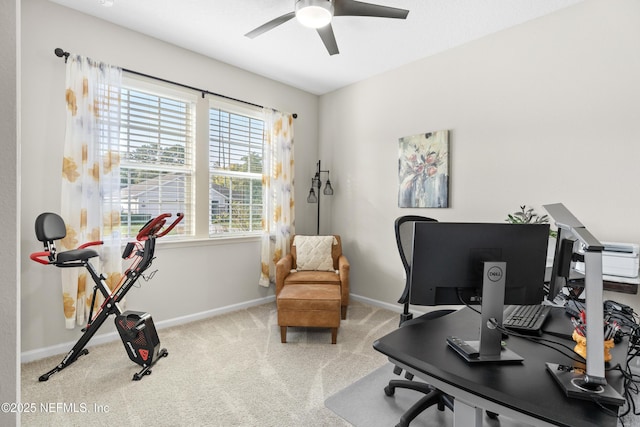 carpeted office featuring ceiling fan