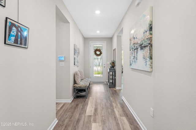 hall with light hardwood / wood-style floors