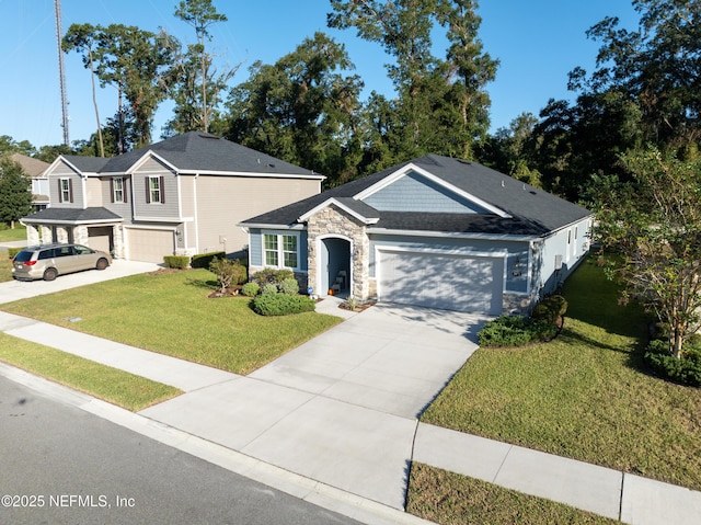 view of front of property featuring a garage and a front yard