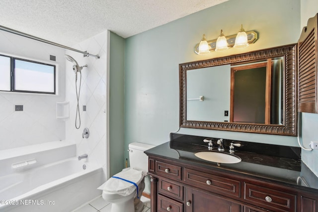 full bathroom featuring toilet, tiled shower / bath combo, tile patterned floors, a textured ceiling, and vanity