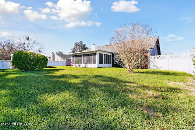 view of yard featuring a sunroom