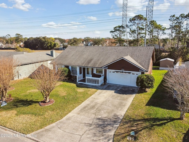 ranch-style home featuring a front yard, a garage, and a porch