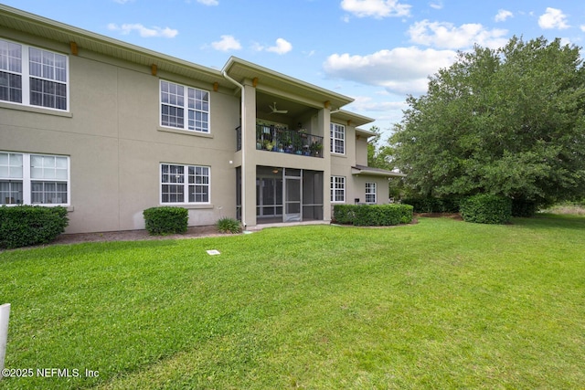 rear view of house with a lawn