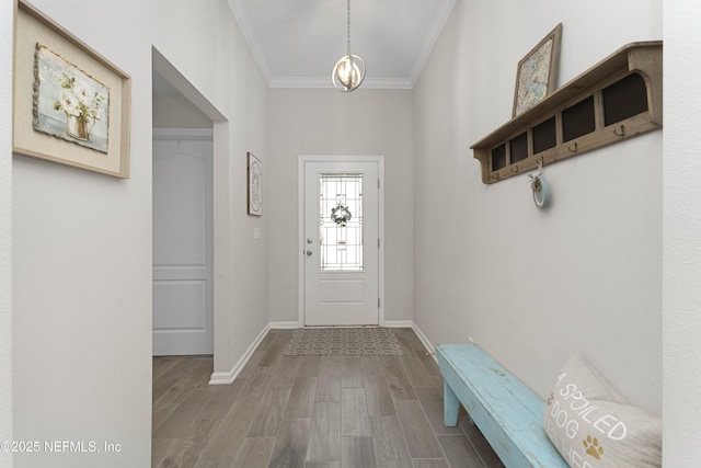 entrance foyer with crown molding and hardwood / wood-style flooring