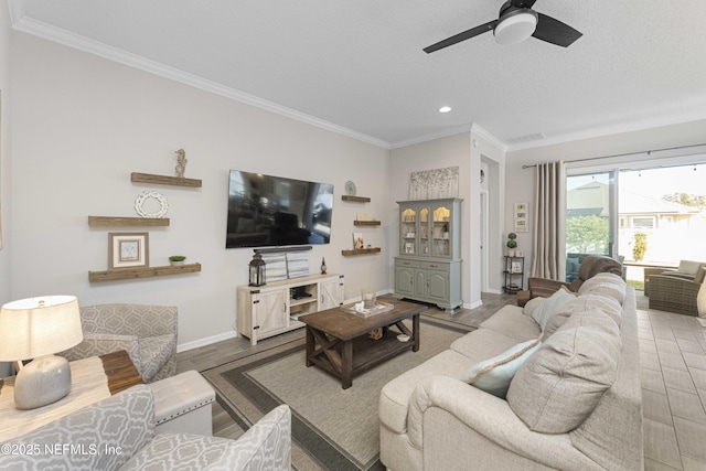 living room featuring ceiling fan, crown molding, and wood-type flooring