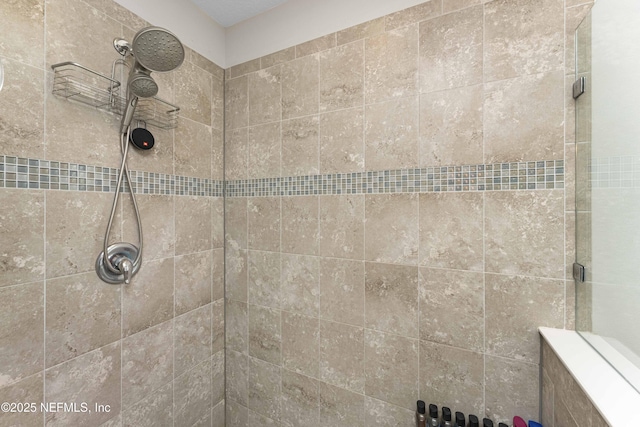 bathroom featuring tiled shower