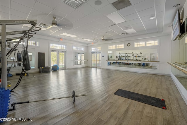 workout area with hardwood / wood-style flooring and ceiling fan