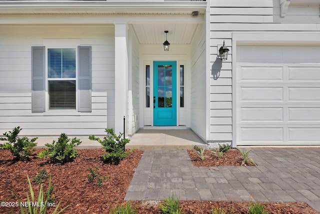 doorway to property featuring a garage