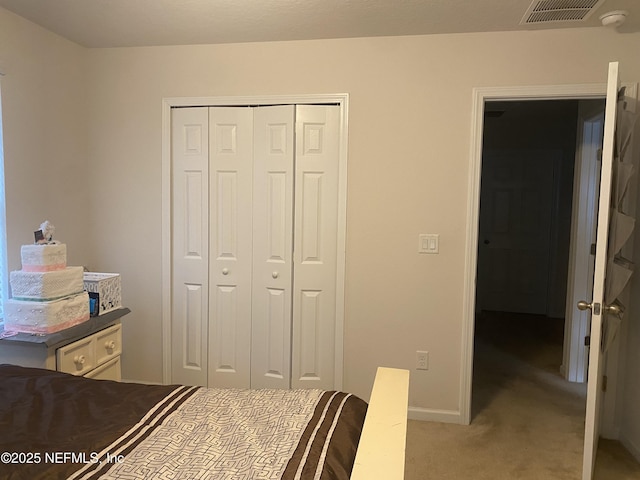 unfurnished bedroom with a closet and light carpet