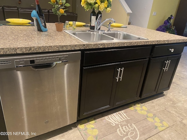 kitchen with an island with sink, light tile patterned floors, dishwasher, and sink