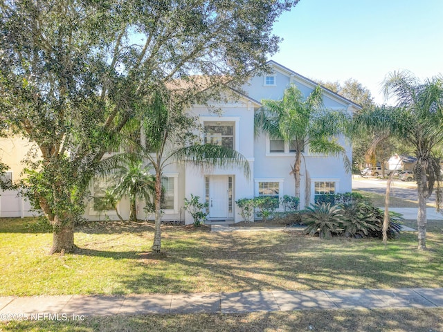 view of front of home featuring a front lawn