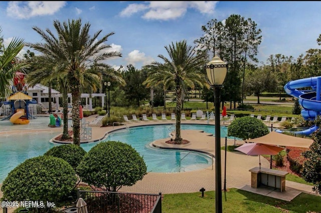 view of pool with a water slide