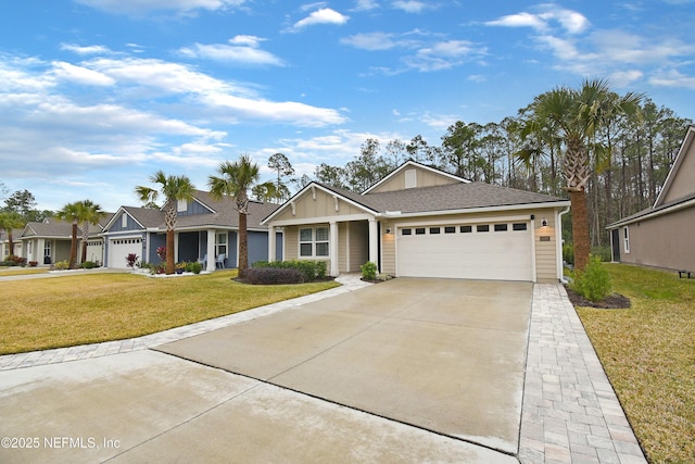 view of front facade with a garage and a front yard